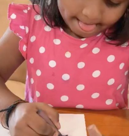 The look of pure concentration. This student is completely in the zone, showing the therapeutic and focusing power of creating art.