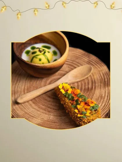 For a festive celebration like Diwali, we create curated delicacies that add a touch of luxury. This platter features a savory fried roll and a creamy soup shot, presented with rustic elegance.