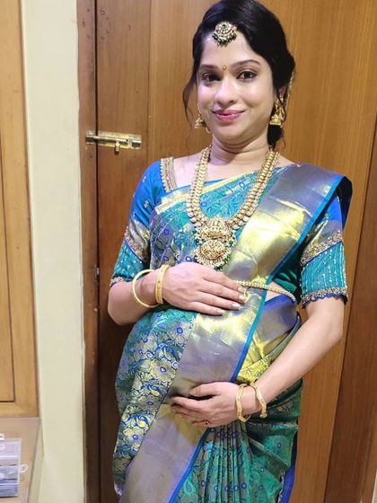 Draping for a baby shower (Seemantham) ceremony. The client looks radiant in her silk saree, which I draped to ensure both comfort and traditional elegance.