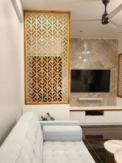 We love the luxurious feel of this Armani Brown Italian marble flooring with brass inlay, which grounds the light and airy living room furniture.