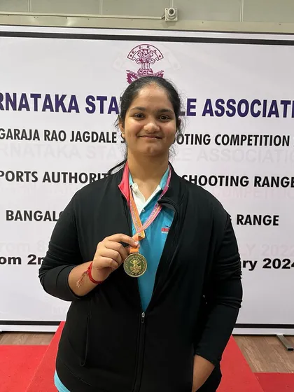 Dhanvi with her bronze medal from the Air Pistol Women's team event.