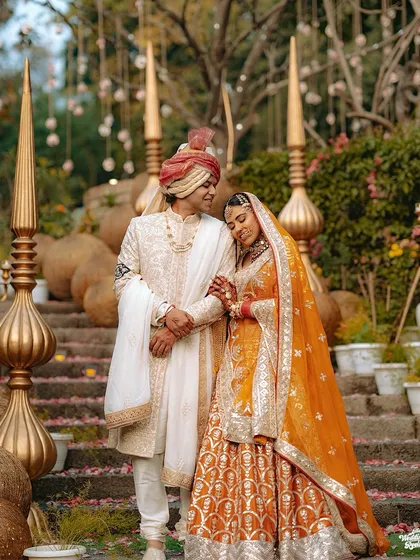 A beautiful portrait of the bride and groom in their stunning wedding attire, sharing a quiet moment after the ceremony.