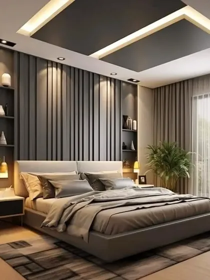 We create serene master bedrooms that serve as personal retreats. This design showcases a sophisticated accent wall with vertical fluting, integrated shelving, and layered lighting to build a calm and luxurious atmosphere.
