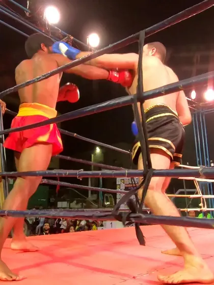 A close-up shot of the intense exchange of punches between the two pro fighters.