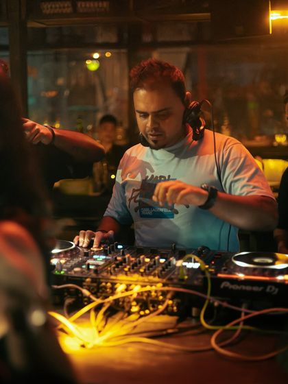 A close-up of me focused on the intricate details of the mix.