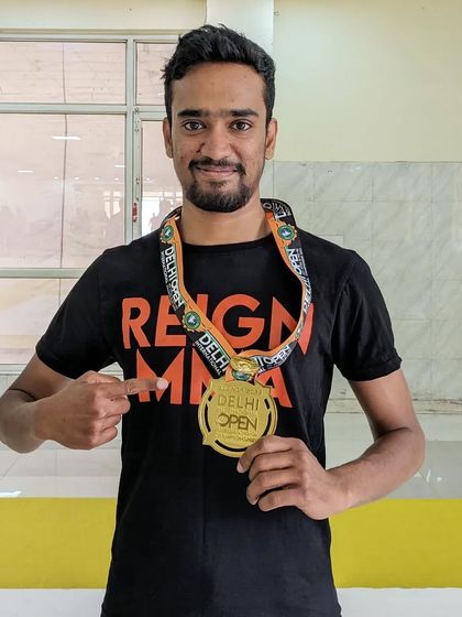 Suraj with his gold medal at the SJJIF Delhi Open.