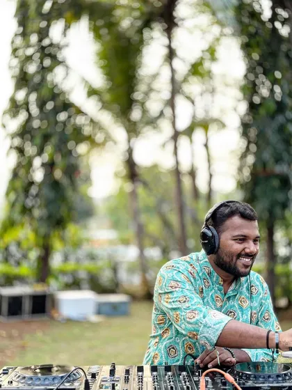All smiles during a daytime wedding function. Whether it's for a Mehendi or a Baraat, I bring the right energy and a custom playlist to match the celebration. My job is to keep the good vibes flowing.