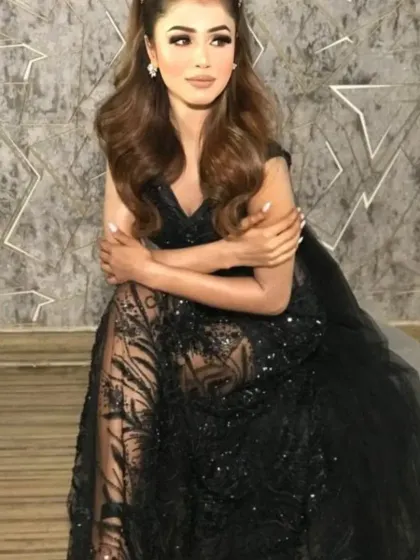 Another angle of the black sheer gown, showing the intricate pattern of the sequins.