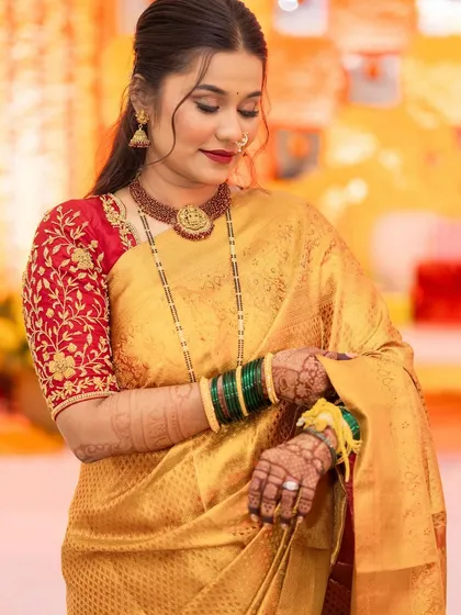 The bride looking down, a serene moment captured during her reception.