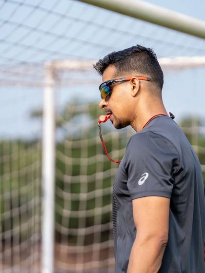 Blowing the whistle to start or stop a drill. The sound that commands attention and effort.