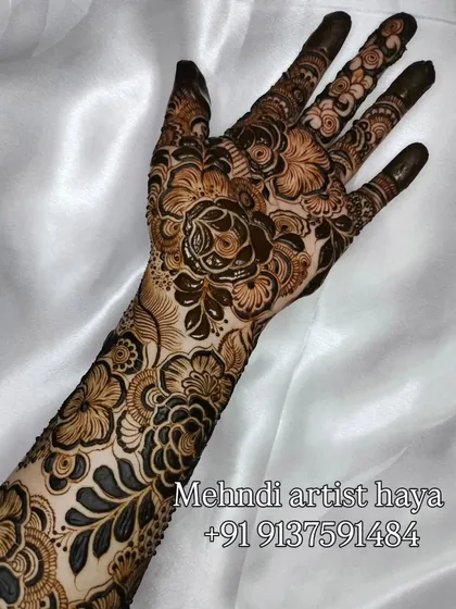 A full-coverage floral design that feels both classic and fresh. The placement of the flowers creates a beautiful, cascading effect down the arm.