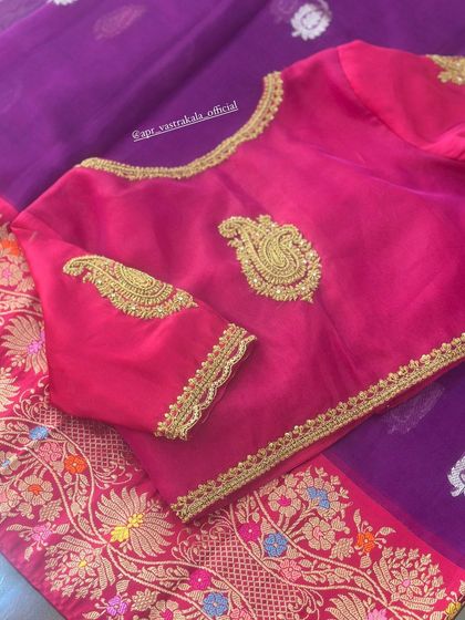 A simple pink blouse with elegant paisley embroidery in gold zardosi.