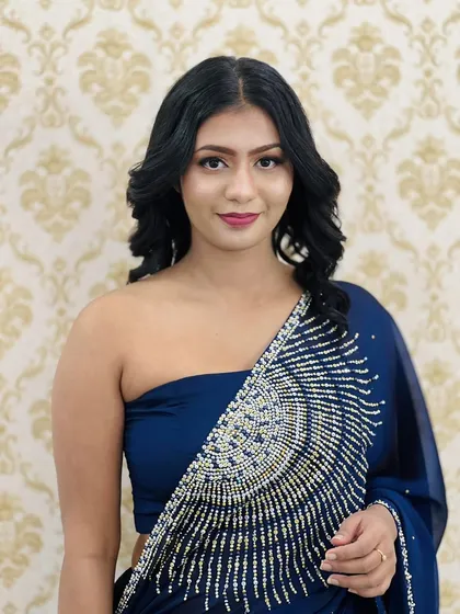 A direct portrait showcasing the balanced and beautiful party makeup. The eyes are the focus, but the overall look is harmonious and enhances her natural features.