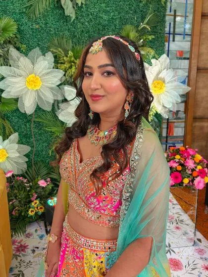 Another angle of this vibrant Sangeet look, showing off the beautiful details of her outfit and the fresh, glowing makeup.