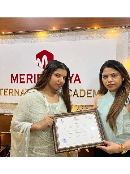 A sparkling future ahead! This graduate receives her certificate, surrounded by lights that match her bright potential.