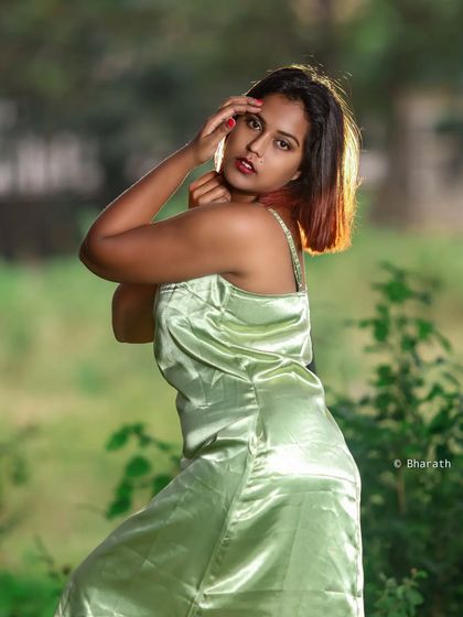An outdoor editorial shot with a satin dress. The backlighting from the sun highlights the subject and creates a beautiful glow.