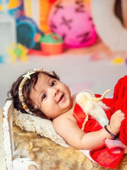A Moana-inspired beach theme. This colorful and fun setup is perfect for a tropical milestone session.