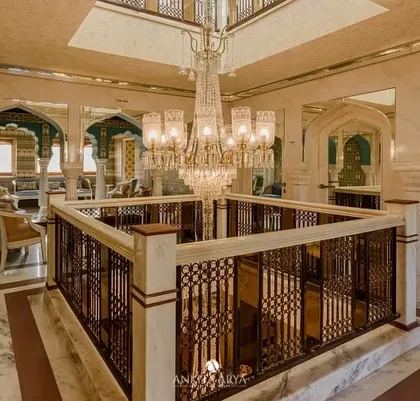 The grand atrium of the Surya Haveli in Jaipur. While my wallpaper is in the adjoining rooms, this view captures the overall sense of opulence and heritage that my designs were created to complement.