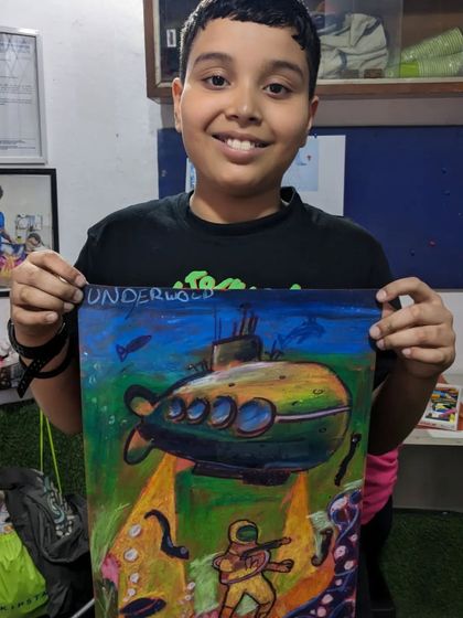 We love celebrating our students' hard work. Shaurya was our best student for this quarter, and here he is with his amazing underwater-themed oil pastel drawing.