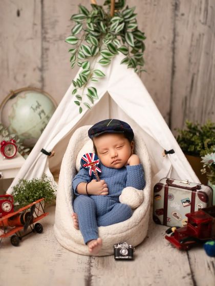 Ready for an adventure. This little traveler theme features a miniature tent, globe, and suitcase, perfect for a family that loves to explore.