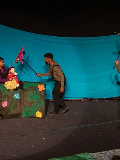 Puppeteers use rod puppets to create a lively garden scene in 'Aisha's Journey'. The performance is filled with colourful characters and magical moments.