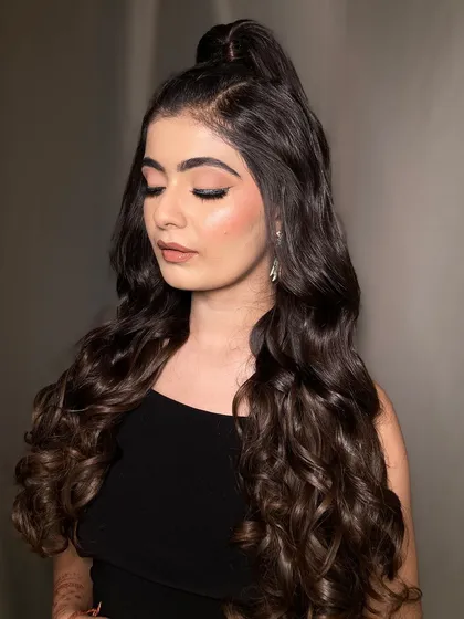 A close-up of the soft glam eye makeup paired with the wavy ponytail. The look is defined but not heavy, perfect for someone who wants to look effortlessly chic.
