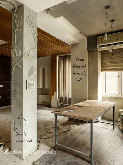 An on-site photo showing an experiment with a fiber mural on a structural pillar, turning a challenge into a design feature.