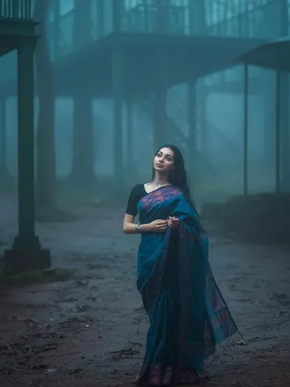 A wider shot from the monsoon series, showing the scale of the misty woods. It feels like a scene from a movie.