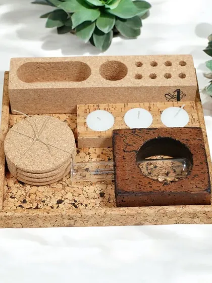 This compact cork desk organizer set is perfect for keeping essentials tidy. It includes coasters, tea light holders, and storage compartments in a convenient tray.