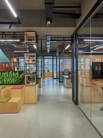 An unconventional reception area that doubles as a collaboration space, featuring tiered, amphitheater-style seating. This design encourages interaction from the moment someone steps into the office.