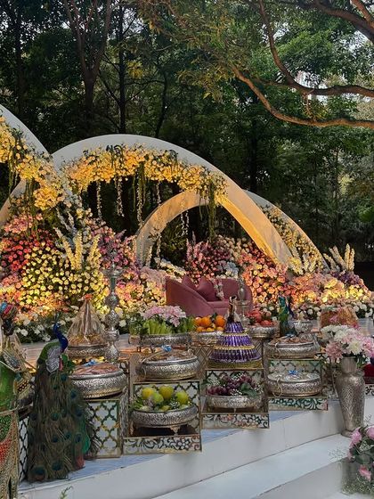 An angled shot of the illuminated arches and the detailed offering table.