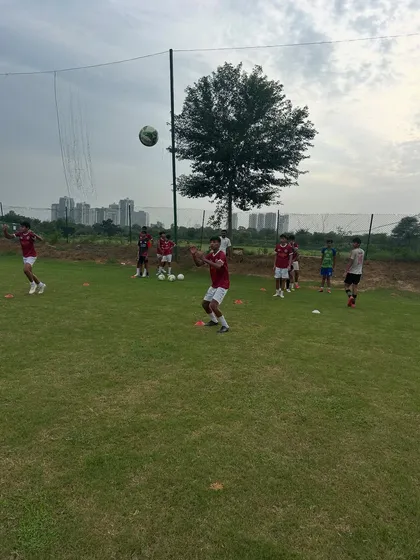 Players practicing heading and ball control during a fitness-focused training day. We integrate technical skills into our physical conditioning.