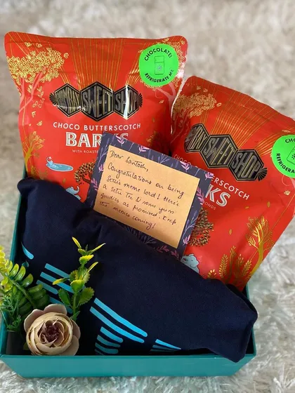 Celebrate team success with a personal touch. This appreciation gift for a teammate includes their favorite snacks and a new t-shirt, complete with a handwritten note of congratulations. We can help you create personalized gifts that make your employees feel truly valued.