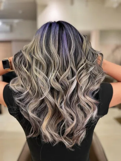 This is my 'Winter Frost' look. I combined cool ash tones with a peekaboo of purple for a unique and trendy style. This look uses bleach to achieve those icy blonde and pastel purple shades.