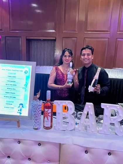 A guest poses with our products at the MASTACON conference. Our bar becomes a central point for networking and socializing.