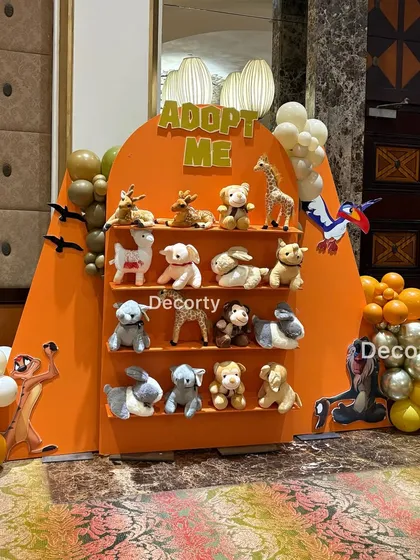 Another view of the "Adopt Me" wall, showcasing the variety of adorable plush animals available for the little guests.
