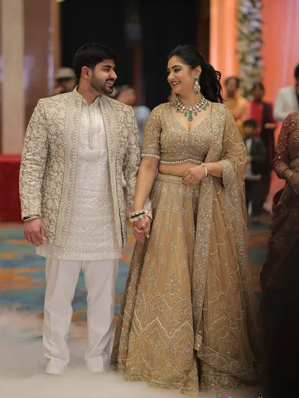 For our engagement, we chose sparkling, neutral outfits that felt both grand and personal. I believe a couple's style should be a conversation, and here, our coordinated embroidered ensembles speak of timeless elegance.