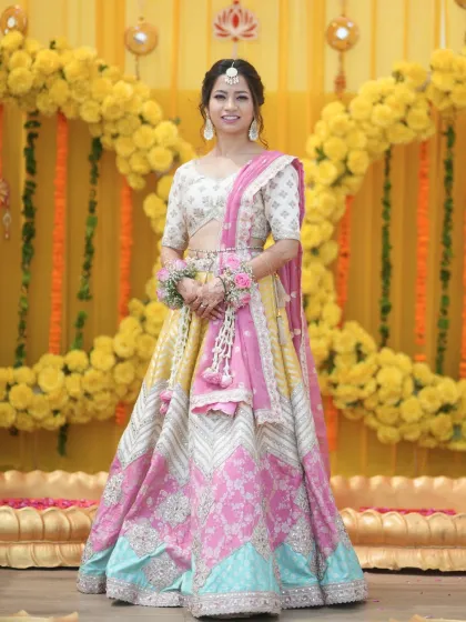 A smiling portrait of the bride. Her makeup is fresh and dewy, with a focus on a natural, radiant glow.
