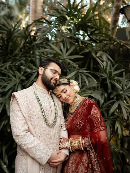 A tender moment where the bride rests her head on the groom's shoulder. These are the simple, heartfelt gestures that define a love story.