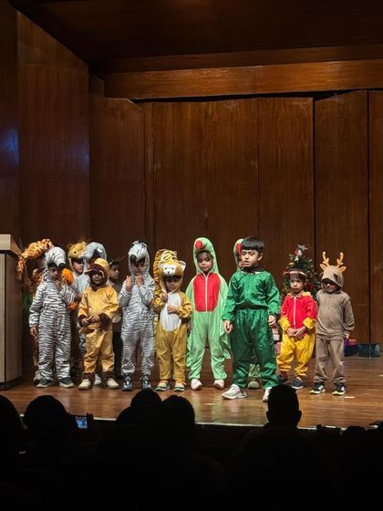 The full ensemble of our animal-themed play, a vibrant and energetic group of young performers.