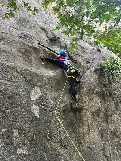 A climber practices lead climbing techniques on a challenging route in Ramanagara. Our courses are designed to help you progress your skills, building the confidence and expertise needed to lead your own climbs.