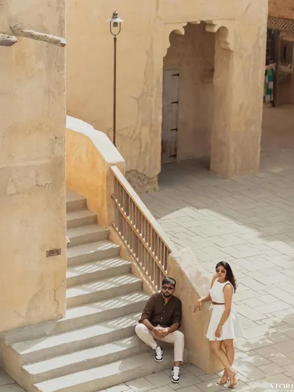A high-angle shot of the couple, capturing the texture and layout of the location.