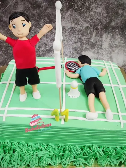 The full view of the badminton court cake, showing the fun scene I created with the two players.