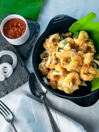 Golden and crispy, our garlic butter-infused fried squid steals the show at our seafood festival. It's a crunchy and flavorful delight.