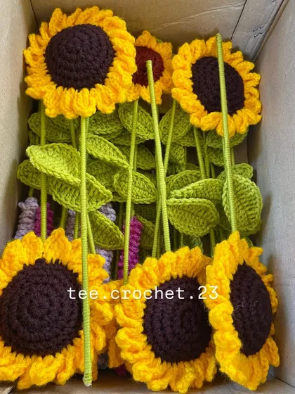 A box of freshly made sunflower stems, ready to be shipped to a client.