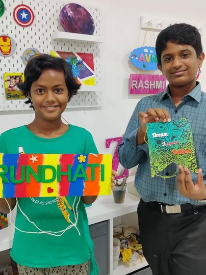 So proud of their creations! These cousins spent their vacation time at the studio making a colorful nameplate and a cool banner.