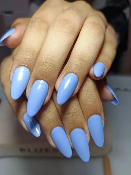 How gorgeous are these blue nails? This solid periwinkle blue on almond-shaped extensions is perfect for beating the summer heat with a cool, fresh color.