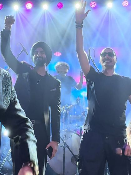 This picture says it all. Sharing a moment of triumph on stage after a killer set. The energy, the lights, the crowd, it's a perfect memory.