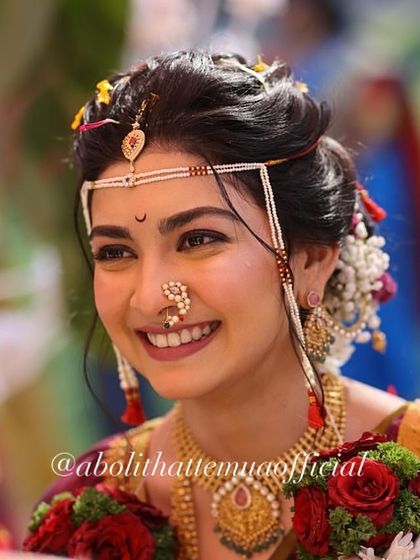 A candid, happy moment between the bride and groom. Her makeup looks fresh and natural even in this close-up shot.