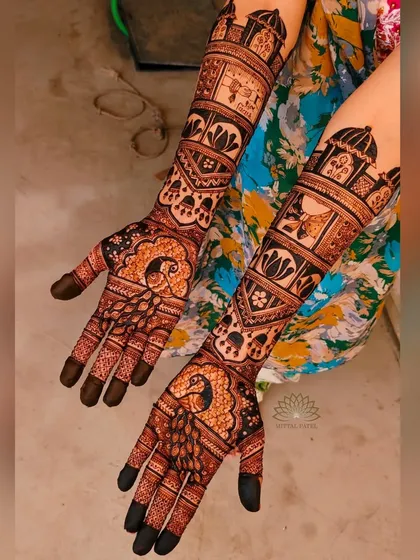 A beautiful bridal design with large peacocks on the palms and traditional motifs on the arms.